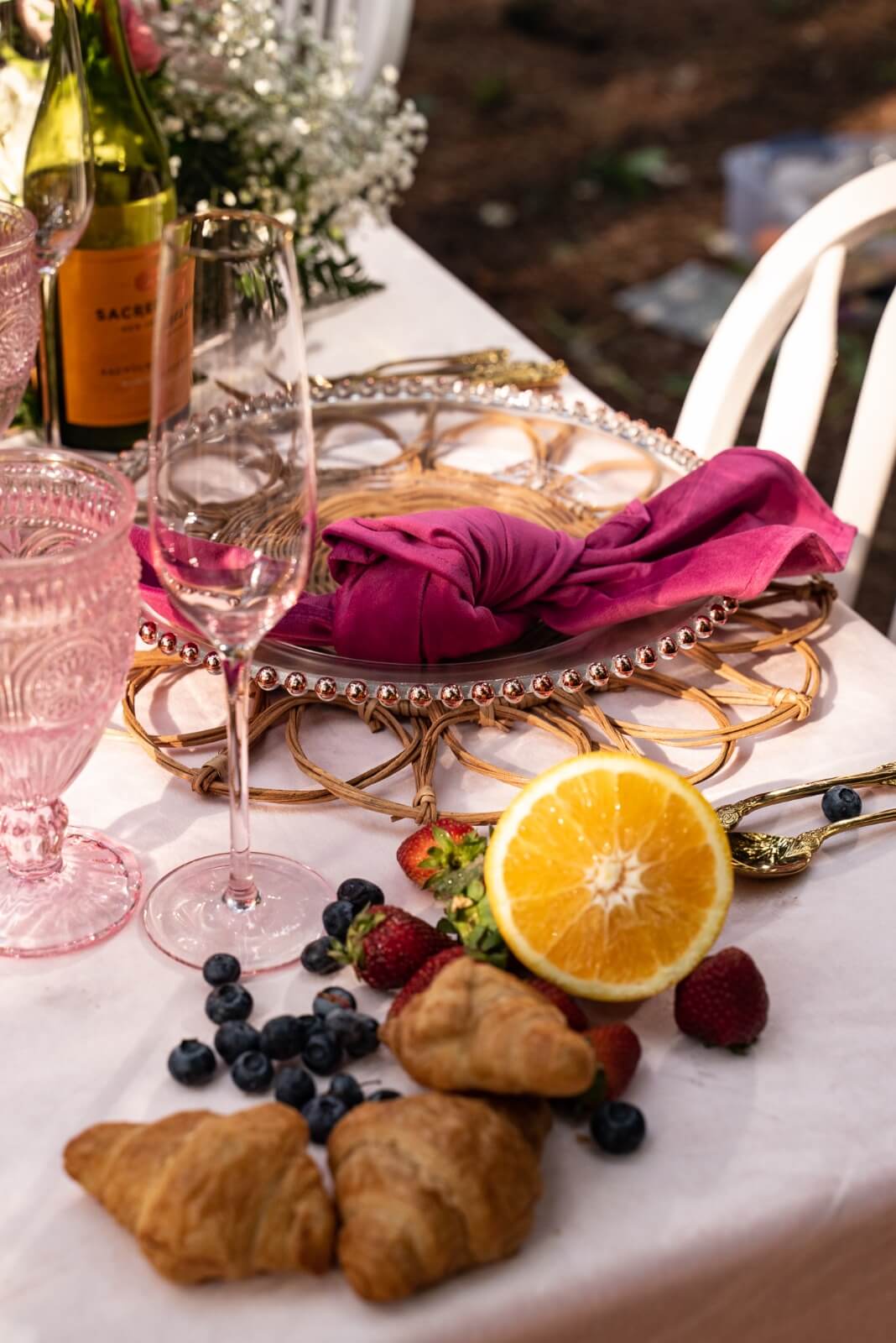 Blush pink velvet table cloth rent for wedding in Vaughan Rattan charger plate rent 